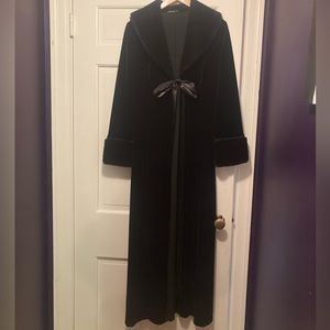 Dramatic long coat. Black velvet, fake fur collar and cuffs, and ribbon tie.